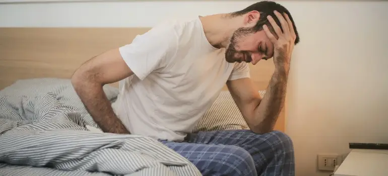 Meth withdrawal depicted Man suferring from back pain